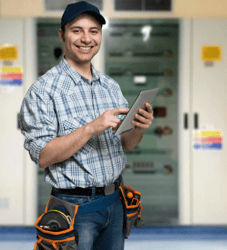 electrician company owner holding tablet while smiling